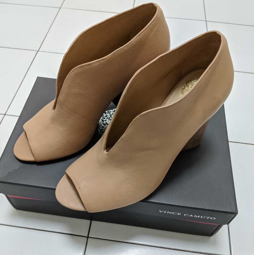 Nude leather booties by Vince Camuto.